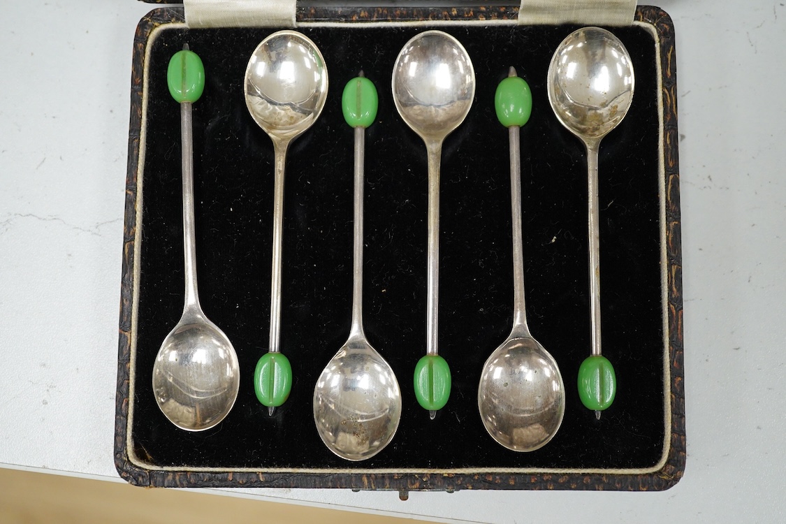 A quantity of plated wares to include two dishes and a cased set of six coffee bean spoons